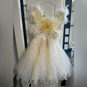 Glittery and glowing angel costume